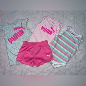 Puma set. 2 onesies, 1 short set, 1 pair of shorts. Size 3-6 months.